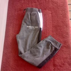 Dark gray sweatpants with white Kenneth Cole logo / writing down left leg  Black