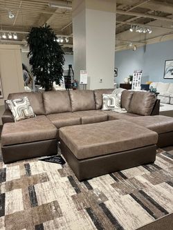 Sleek Large Sectional features double Chaise & contrasting rich brown finish