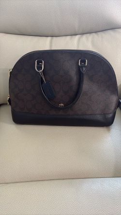 Brown and black coach purse