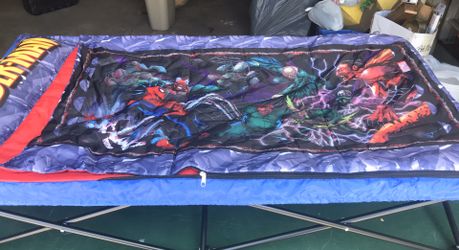 Boys’ folding camping bed with sleeping bag cover.