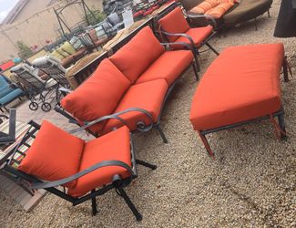 $1200 ARIZONA IRON PATIO SET WITH BRAND NEW SUNBRELLA CUSHIONS 2 SWIVEL CHAIRS AND CURVE COUCH AND OTTOMAN