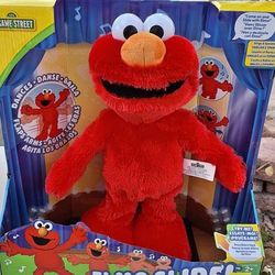 Sesame Street Elmo slide dancing plush
Muñeco de Elmo que baila