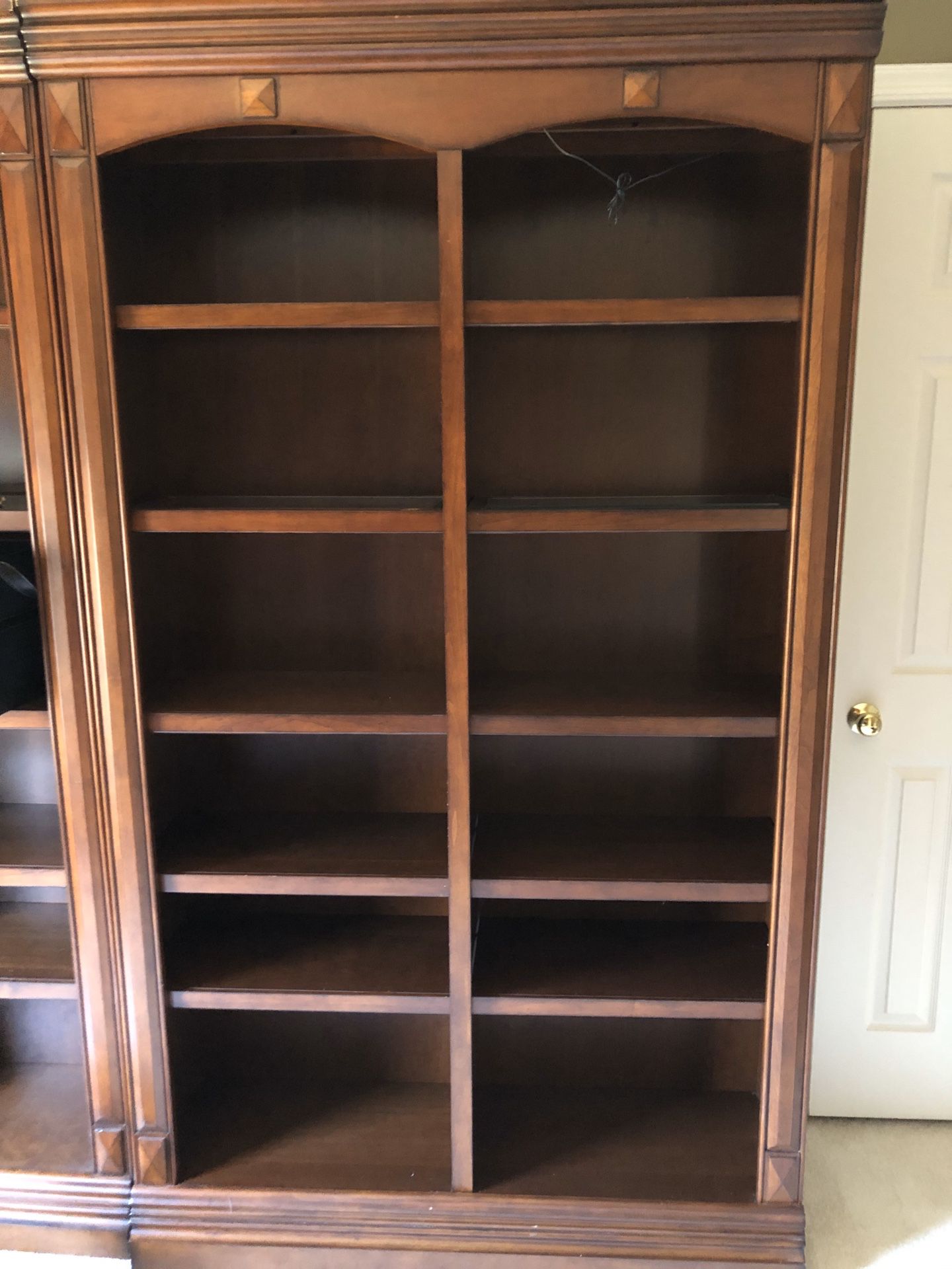 Cherry bookcases with top shelf lighting