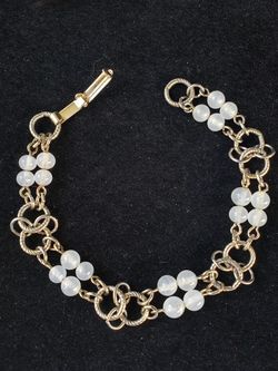 $10. Vintage clear glass bead bracelet. Gold tone. 7 inch long. 5/8 inch wide.