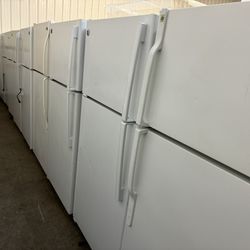 Several Clean White Refrigerators
