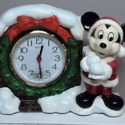 Disney Seiko mantle clock is a must-have for any Disney fan. Featuring Santa Mickey Mouse, this ceramic clock was manufactured in Japan in 1987.