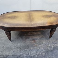 Antique Oval Coffee Table With Original Gold Design And Ball Casters