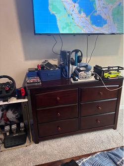 Dresser, full size bed with two drawers.