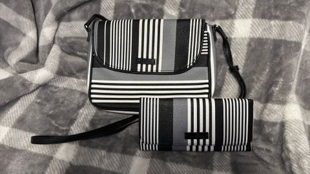 This Vera Bradley crossbody purse and wallet features a black, white, and gray striped pattern with a prominent black brand logo plaque on the front