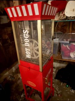 Hot dog roller machine