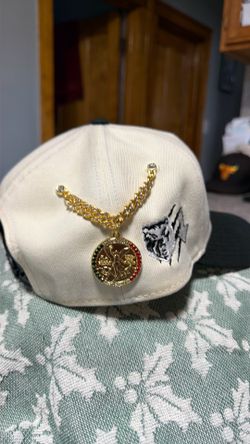 Centenario hat pin.