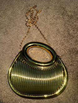 Gold metallic oval clutch evening bag