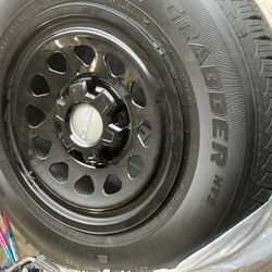 General Grabber 255/70R17 Tires on stock steel GMC Sierra rims with black Caps 6 lug Set Of 4