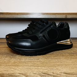 Salvatore Ferragamo Brooklyn Gancini-patch lace-up sneakers in black leather and suede