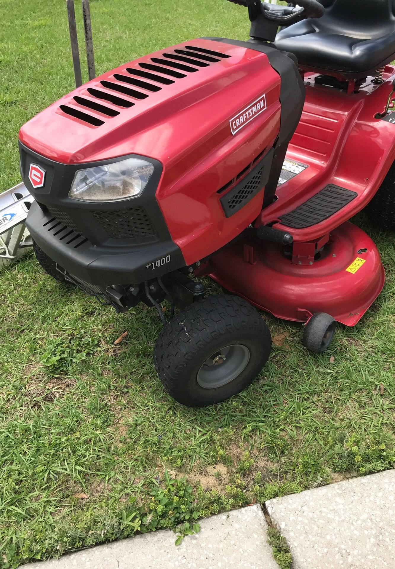 Craftsman T1400 riding lawn mower with aerator attachment. 3 years old. $800