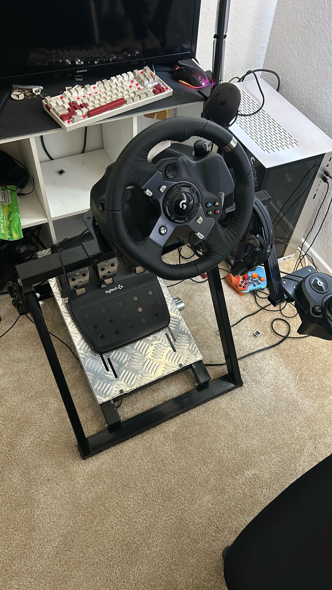 Logitech G920 (or G29/G923) racing wheel and pedals.