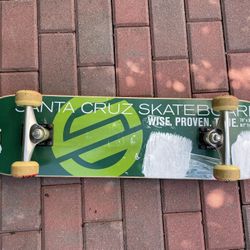 Green Santa Cruz Mountain Dew skateboard
