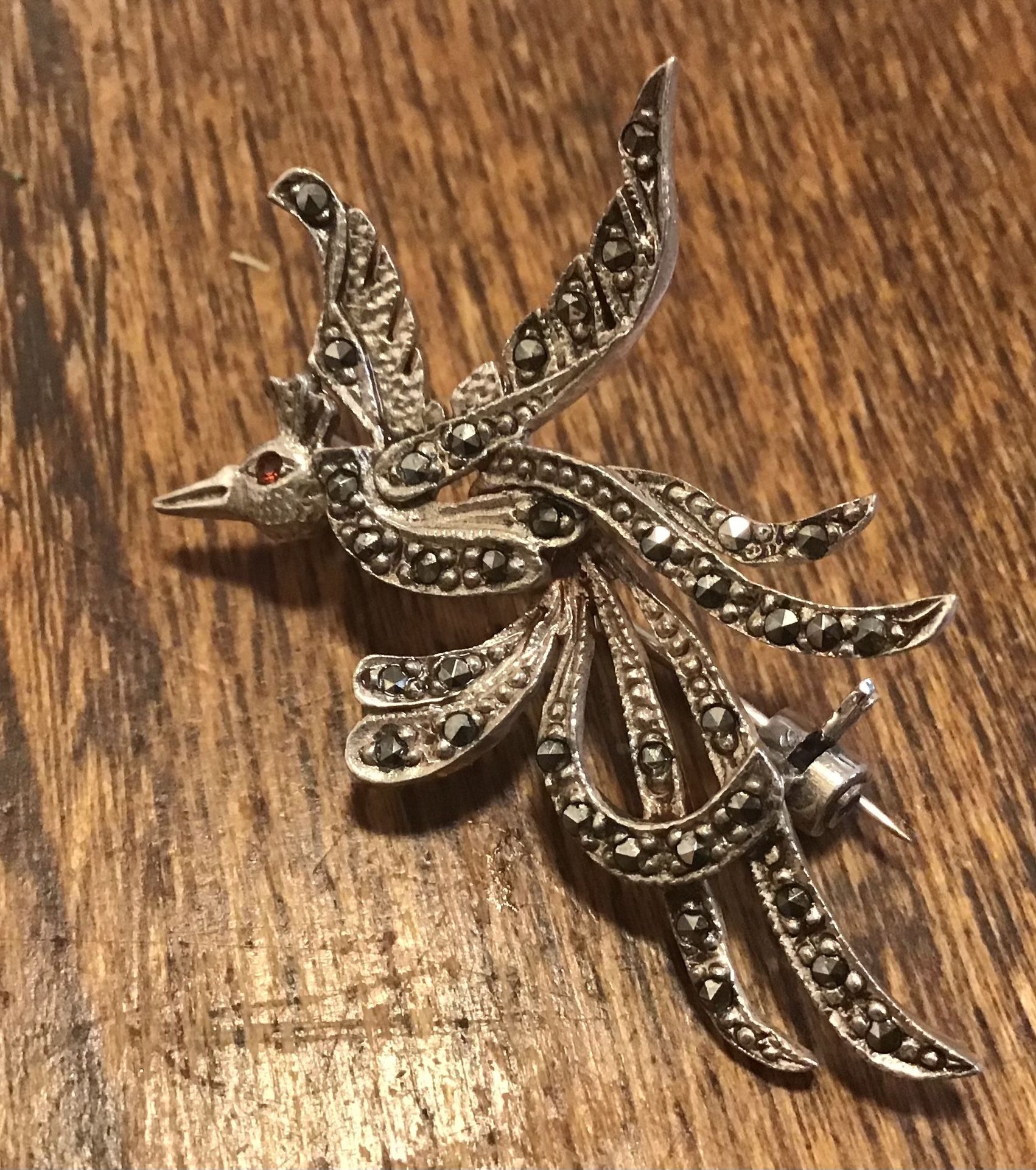 Sterling silver marcasite bird of paradise brooch with ruby eye
