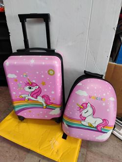 Pink hardside kids' luggage set featuring a unicorn, rainbow, and star design.