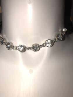 Black leather long rope choker with beautiful big rhinestones. The rope can be twisted around your neck for a thicker layered look, or worse as sho