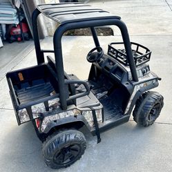 Kids 12V ride-on UTV (Polaris RZR style) + charger (works)