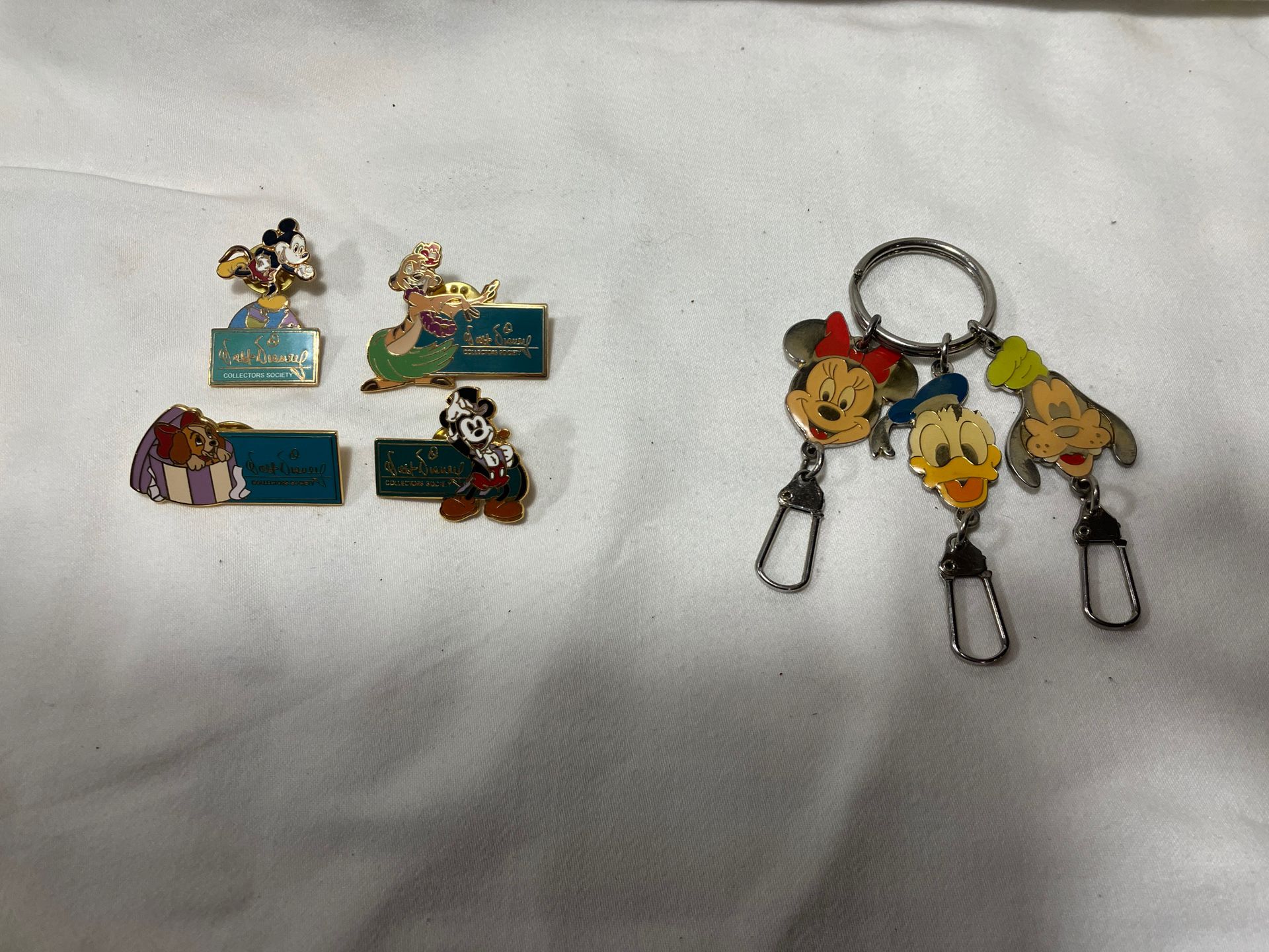 Disney’s Collector Society Pins And Zipper Pulls
