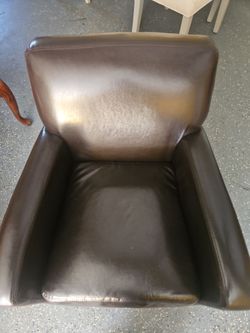 2 brown  faux leather chairs
