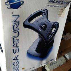 sega saturn arcade racer steering wheel. complete in box excellent new condition 