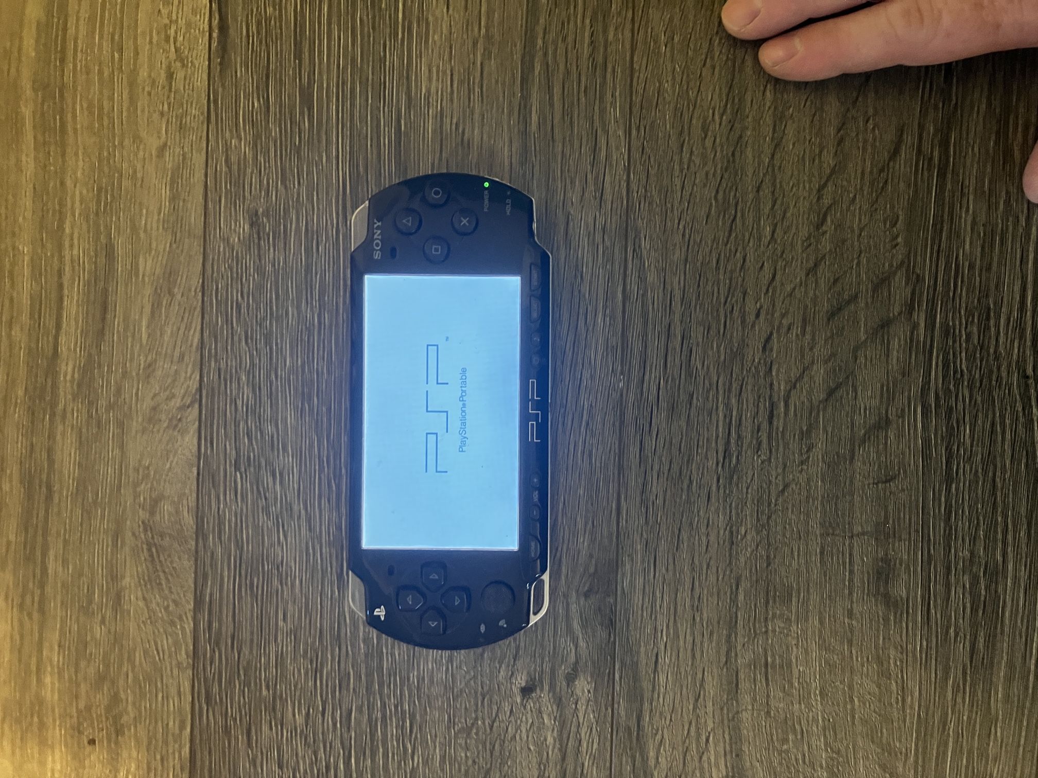 PSP with Charger, Games And Case.