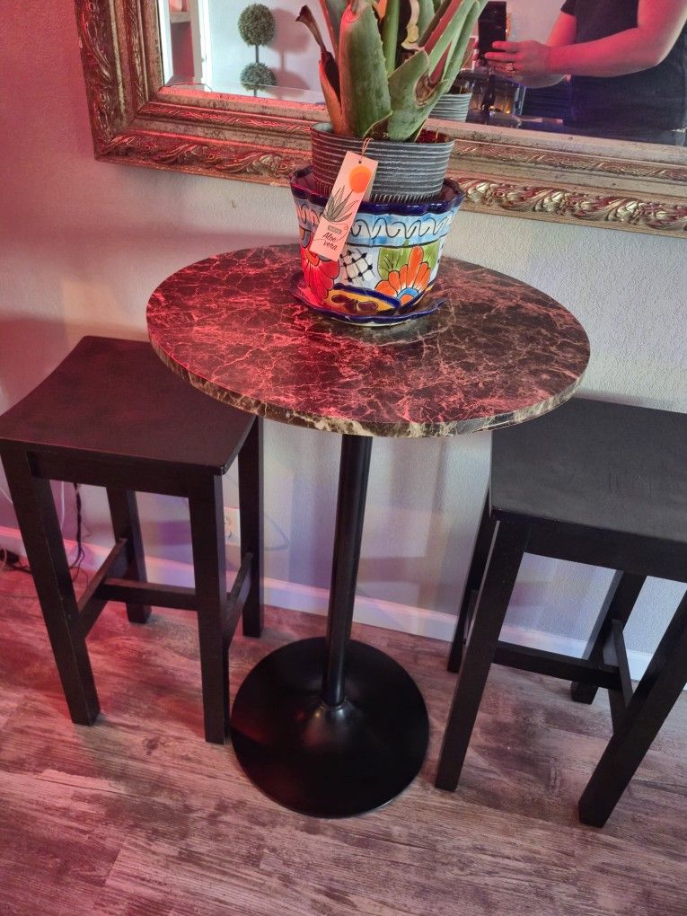 High top Table With Two Black Wooden Bar Stools