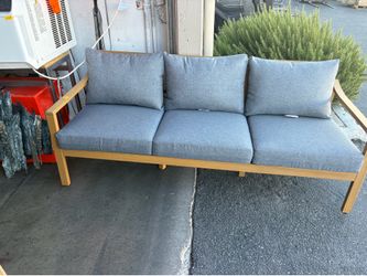 Teak outdoor sofa with cushions $275 cash available at JE merchandise outlet