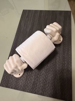 Toilet paper holder shaped like two hands