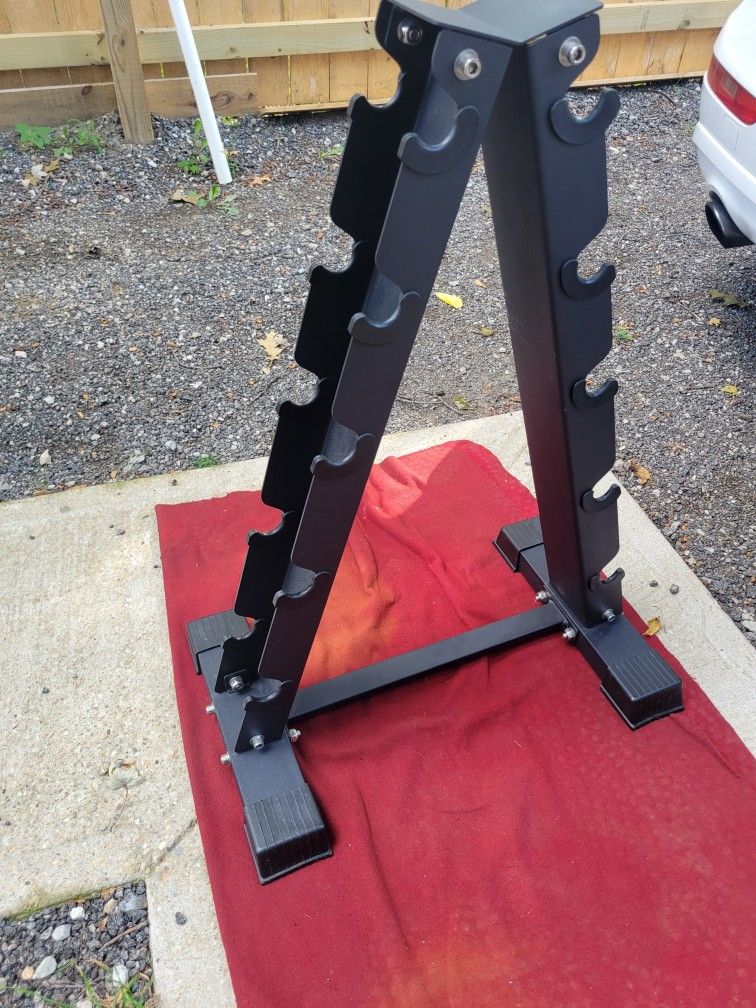 A-FRAME. DUMBBELL RACK HOLDS 5 SETS SOLID STEEL 
11525 S HALSTED DUNKIN DONUTS/7111.S WESTERN WALGREENS 
40$  CASH ONLY AS IS 
