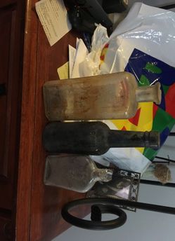 Vintage old bottles with letters on them