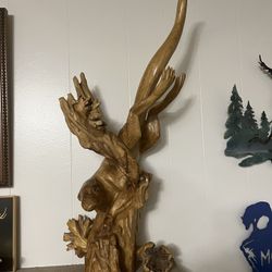 Beautiful Solid Carved Wood Otter Swimming Through Carved Wood Under Water Plants