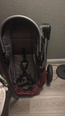 Baby Stroller with Canopy and Harness by evenflow in color burgundy
