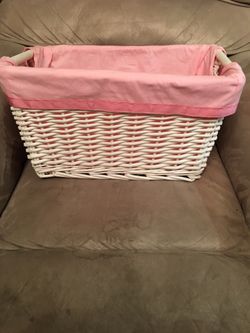 Woven basket with pink liner