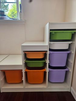 IKEA Trofast storage with binsL 39 inch x W 17 inch.
Perfect for toys, small items, books, etc  Customizable, you can buy bins or boards in IKEA for m