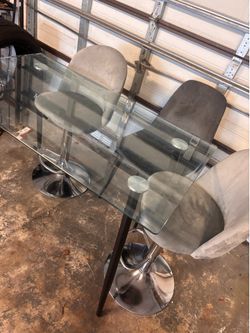 2 stools and glass table