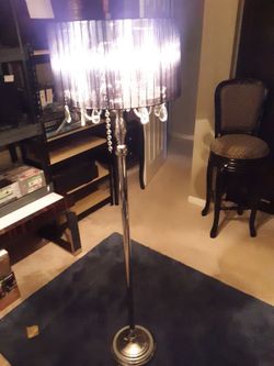 SLEEK LOOKING CRYSTAL LOOK CHROME FLOOR LAMP....AND NO, NOT REAL CRYSTALS....BLACK SHADE MATERIAL IS NYLON... RETAILS NEW FOR 189.95