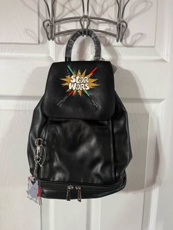 Disney Parks Star Wars Lightsaber Black Backpack Bag.  Brand new with tags.  The picture does not reflect how nice this bag is.  It’s also really soft