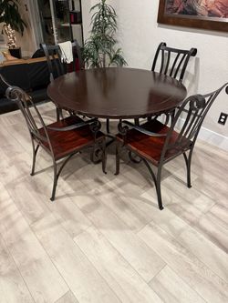 Round dining table and four chairs.