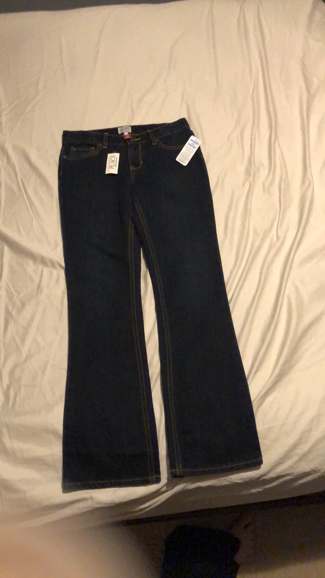 Brand new, girls dark blue boot cut jeans, size 12.