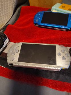PlayStation Portable (PSP) handheld gaming console, likely a 2000 model based on its design.