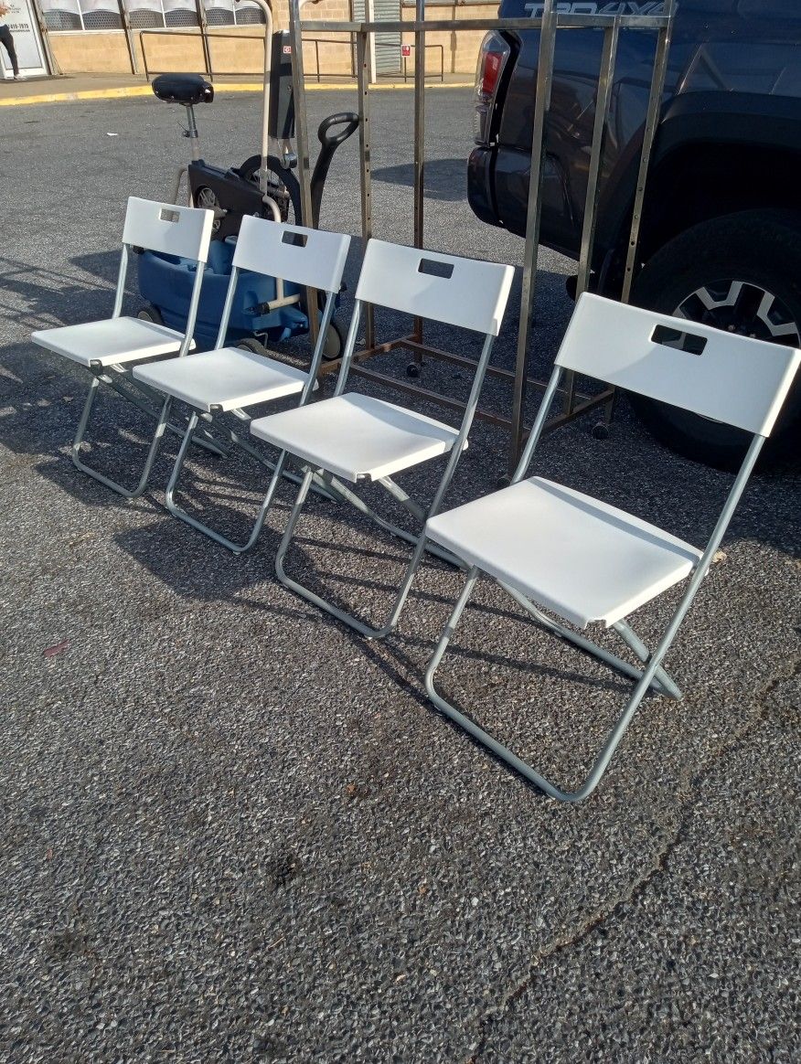 All Four White Foldable Chairs
