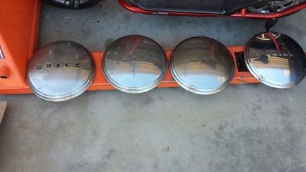Buick Hub caps, 1949. Fits 15 inch rims.