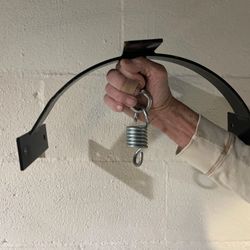 Punching bag holder for between rafters