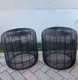 cylindrical black iron wire weave basket.