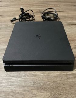 PS4 Slim 1TB + 2 Controllers – Excellent Condition