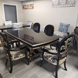 Dining table with 5 chairs 2 with armrests and 3 regular.  Normal wear and tear  $1699 